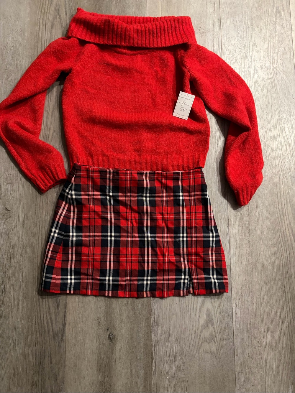 Woman’s Red Off-Shoulder Sweater & Red Plaid Skirt Set